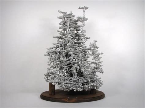 Ant Colony Sculptures Made by Pouring Molten Metal into Ant Nests