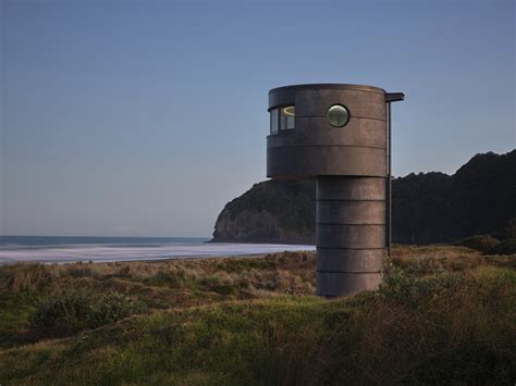 An Elegant Lighthouse Surveys a Beautiful but Dangerous Surf Beach in ...