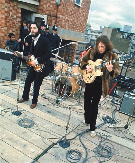 Wondering Wanderer, The Beatles performing live on the rooftop of the...