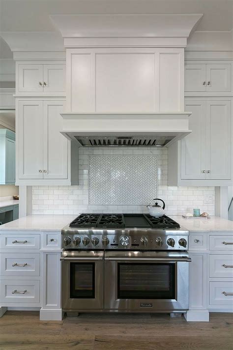 Wooden mantel range hood | Custom kitchen remodel, White shaker kitchen cabinets, White shaker ...