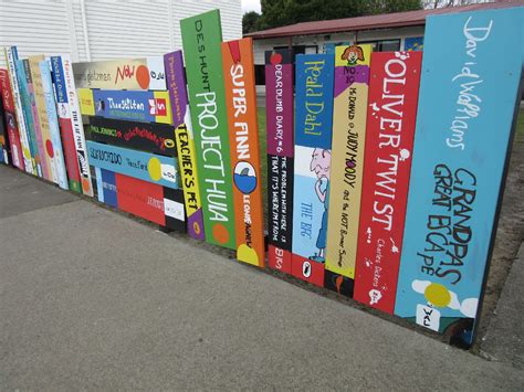 Ahipara fence of book spines | Elementary school library, School ...