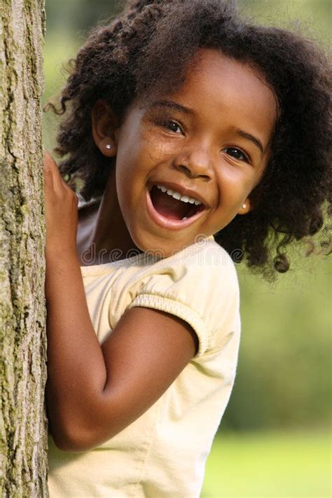 African American Child. Happy African American child playing in a park ...