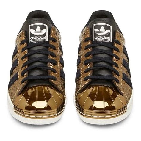 Adidas Originals Black and Gold Superstar Low Top Sneaker ($180) liked on Polyvore featur ...