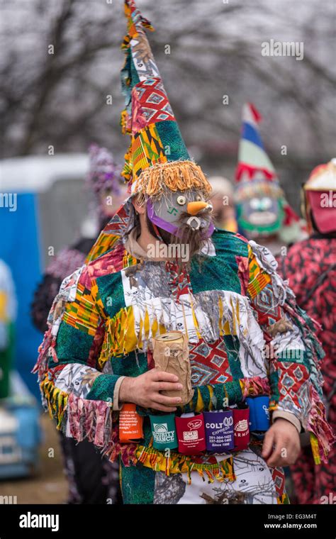 Celebrant wear traditional Cajun Mardi Gras masks and costumes during ...