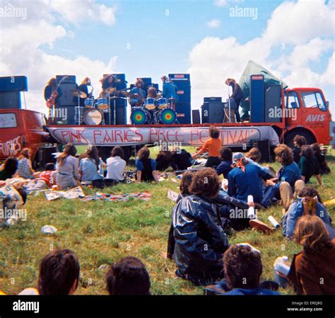 British band Pinkwind - members of The Pink Fairies and Hawkwind playing on a flat-bed lorry at ...