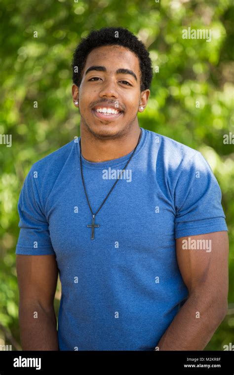 African American teenage boy smiling Stock Photo - Alamy