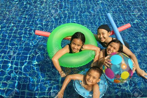 Group Of Children Playing In The Pool Stock Photo, Picture And ... | Exercise for kids, Swimming ...