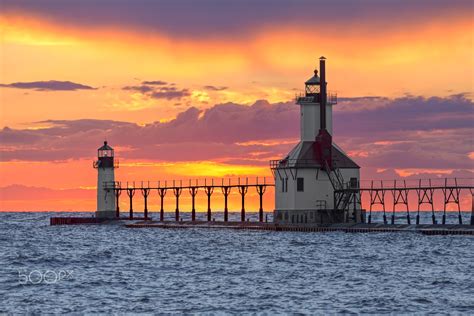 St. Joseph Sunset - The St. Joseph, Michigan North Pier Inner and Outer Lighthouse shine their ...