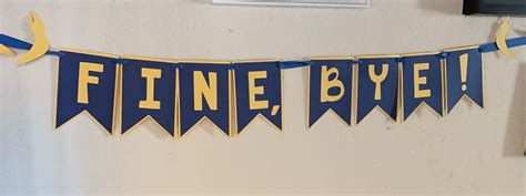 a blue and yellow banner that says finnie byee on the side of a wall