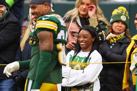 Simone Biles shares a moment with husband Jonathan Owens during Green ...