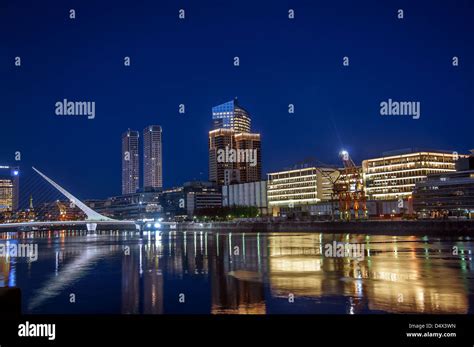 Beautiful Puerto Madero and the Women's Bridge at night Stock Photo - Alamy