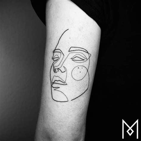 Single line portrait tattoo on the back of the left