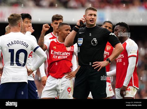 Referee Robert Jones awaits a VAR decision during the Premier League ...