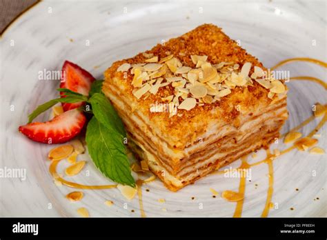 Layered honey cake with nuts Stock Photo - Alamy