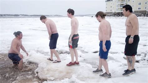 Canadians brave cold waters for polar bear dip - YouTube