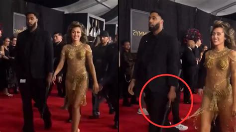 Miley Cyrus' bodyguard in Grammys video sparks debate after fans say to 'pay close attention ...