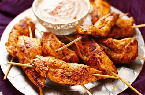 Spanish-style chicken skewers with spicy yogurt dipping sauce | Tesco Real Food