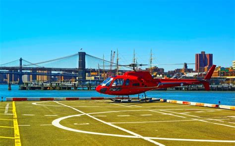 Premium Photo | Helicopter landing at helipad. skyline with skyscrapers ...