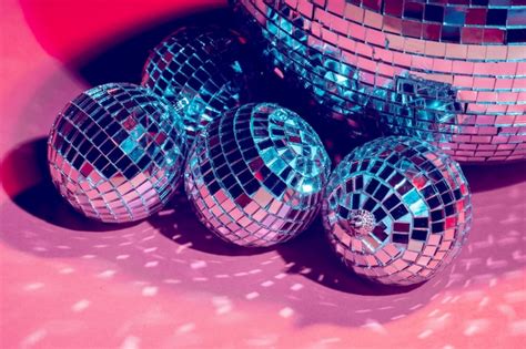 Premium Photo | Mirror disco balls over pink . party, nightlife