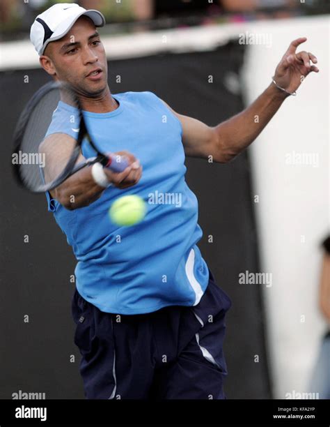 James Blake hits a forehand during the Duel in the Desert tennis ...