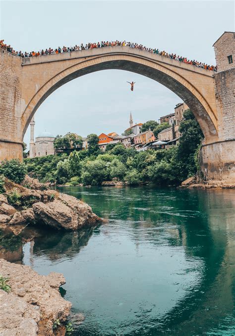 Locals swan diving off Stari Most (Old Bridge) in Mostar, Bosnia ...