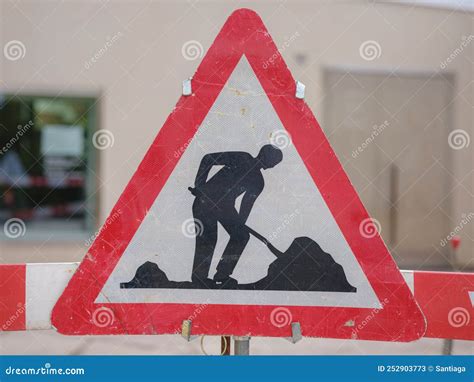 Man at Work Sign on Road stock image. Image of banner - 252903773