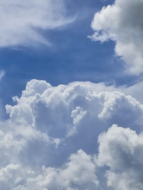 Premium Photo | Blue sky white clouds background portrait