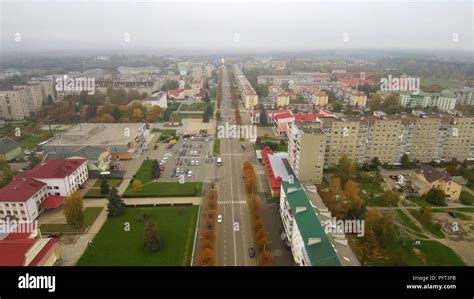 Aerial view from Drone: Town with a road and cars, houses and parking lots Stock Photo - Alamy