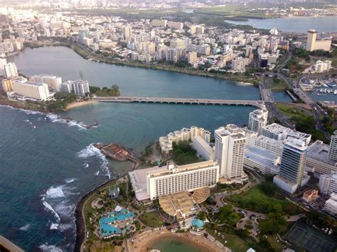 an aerial view of a city and the ocean