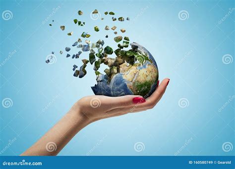 Closeup of Woman`s Hand Holding Earth Which is Breaking into Small ...