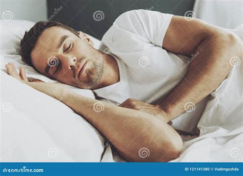 Handsome Man Sleeping in His Soft Bed at Some. Stock Photo - Image of awake, healthy: 121141380