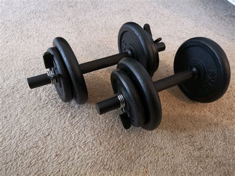 BRAND NEW. 18KG ADJUSTABLE CAST IRON DUMBBELL SET | in Poole, Dorset | Gumtree