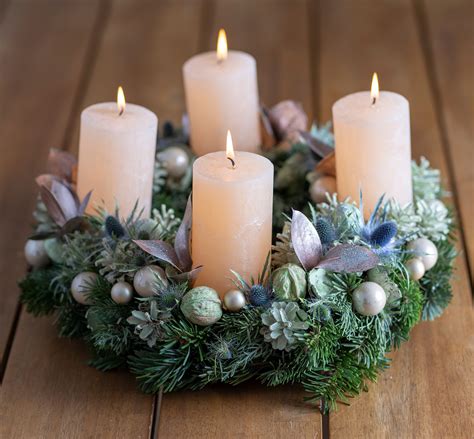 Advent wreath with four burning candles on table | Colorado Christian Fellowship