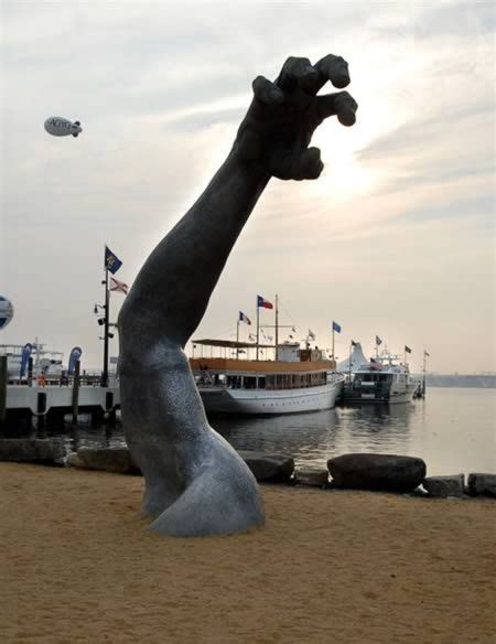 A 100-foot-tall giant emerges from the earth in this famous D.C. cast- alum- inum sculpture. An ...