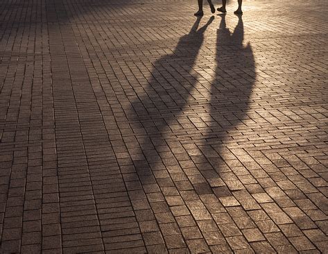 Shadow Of Walking People On Sidewalk Stock Photo - Download Image Now - iStock