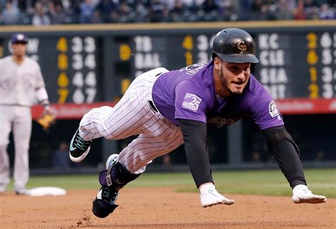 Nolan Arenado, Rockies teammates, learn to play through season of pain