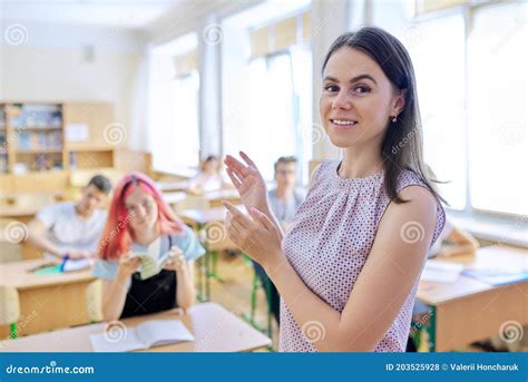 Portrait of Young Female High School Teacher at Lesson Stock Photo ...