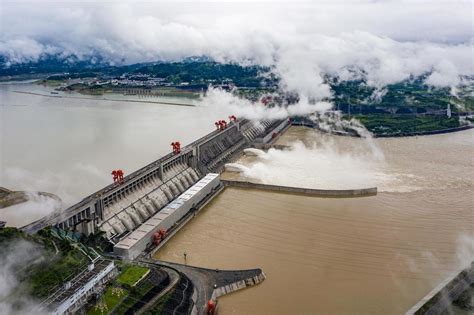 Thousands evacuated as floods threaten a massive dam and a treasured ...