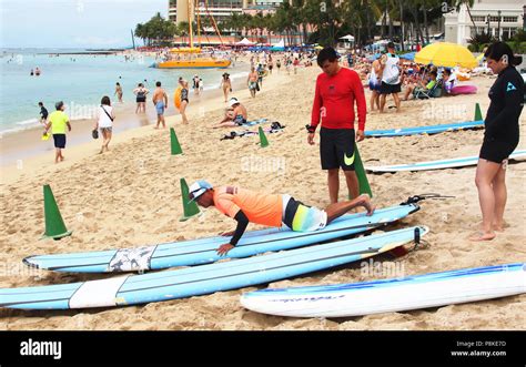 Waikiki beach surfing hi-res stock photography and images - Alamy