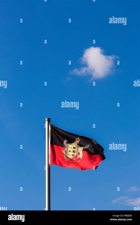 Flag, Kingdom of Württemberg, against blue sky with a small cloud Stock ...