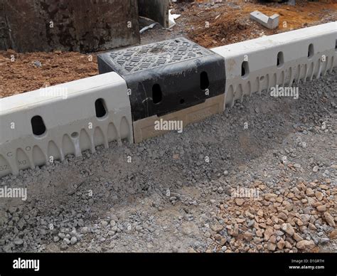 Road construction site closeup detail ACO drainage kerbs and gullies ...