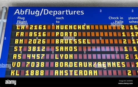 Airport flight information displayed on departure board, flight status ...