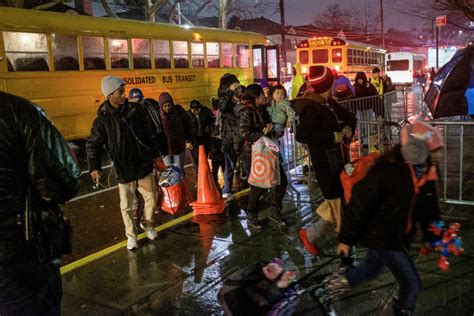 NYC decision to move migrants from tent shelter to a school amid storm draws fire