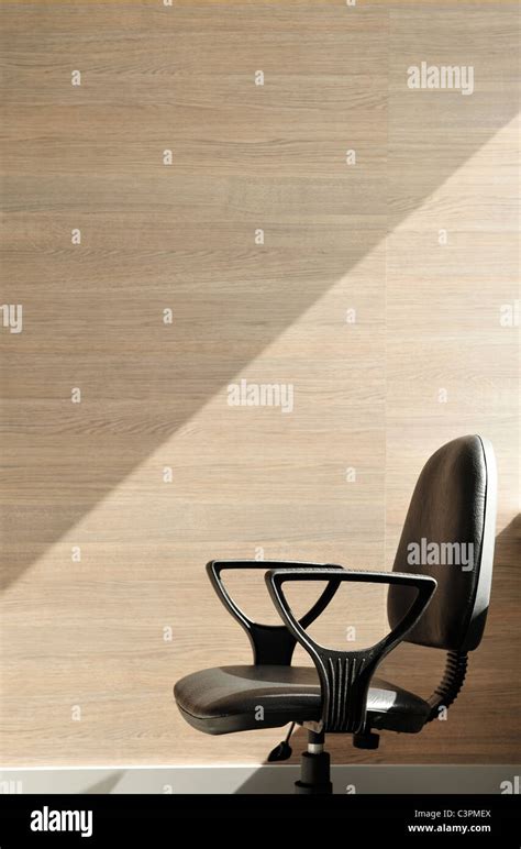 Portrait of an office chair facing the left. Office background Stock Photo - Alamy