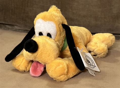 Disney Parks Laying Pluto Plush Dog by Webkinzjourneys on DeviantArt