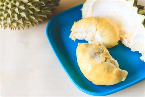 King of fruits, Durian on blue plate. 10718604 Stock Photo at Vecteezy