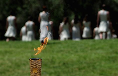 Lighting the 2012 Olympic Flame | Olympic flame, Ancient olympia, Olympics