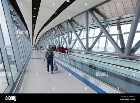 Passengers using moving walkway at Gatwick airport Stock Photo - Alamy