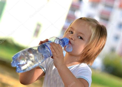 Little girl drinking water Stock Photo by ©muro 6986142