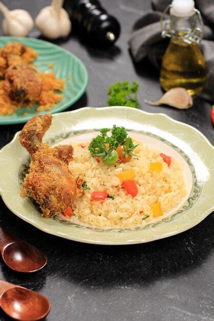 Premium Photo | Butter rice with fried chicken nasi goreng mentega with ...